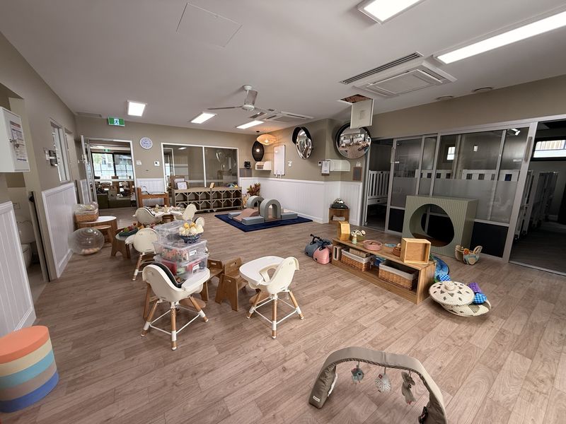 Childcare play room with LED panel lights, ceiling fan and cassette air conditioning