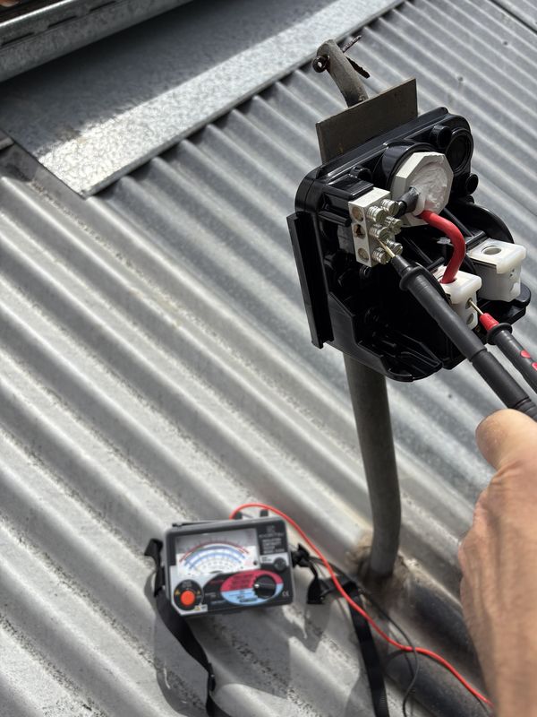 Insulation resistance tester in use on the consumer mains at the roof