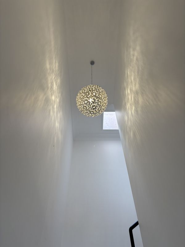 Crystal pendant light in a double height stairwell