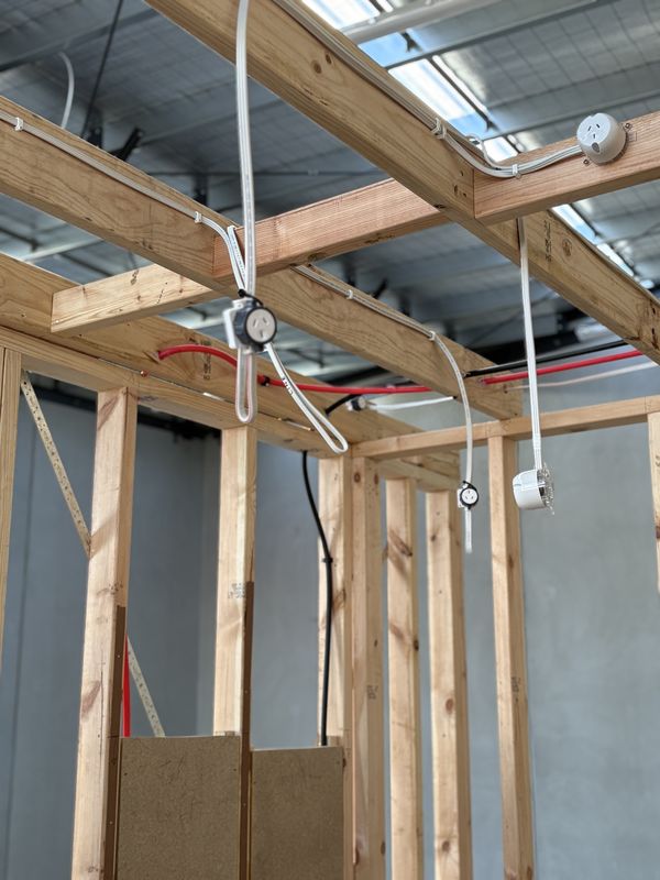 Electrical rough-in of power and lighting cabling in timber framing